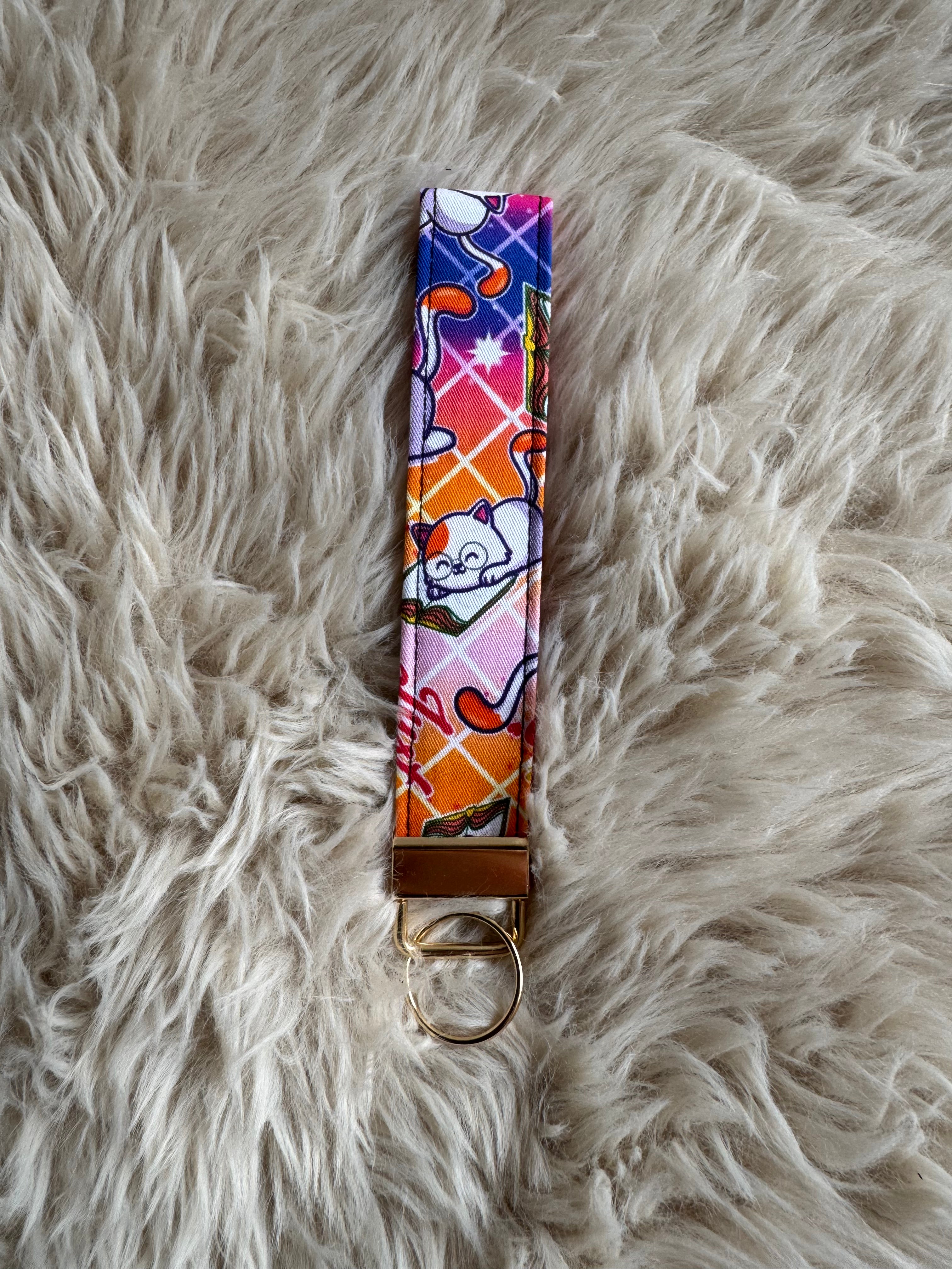 One more chapter kitty Wristlet