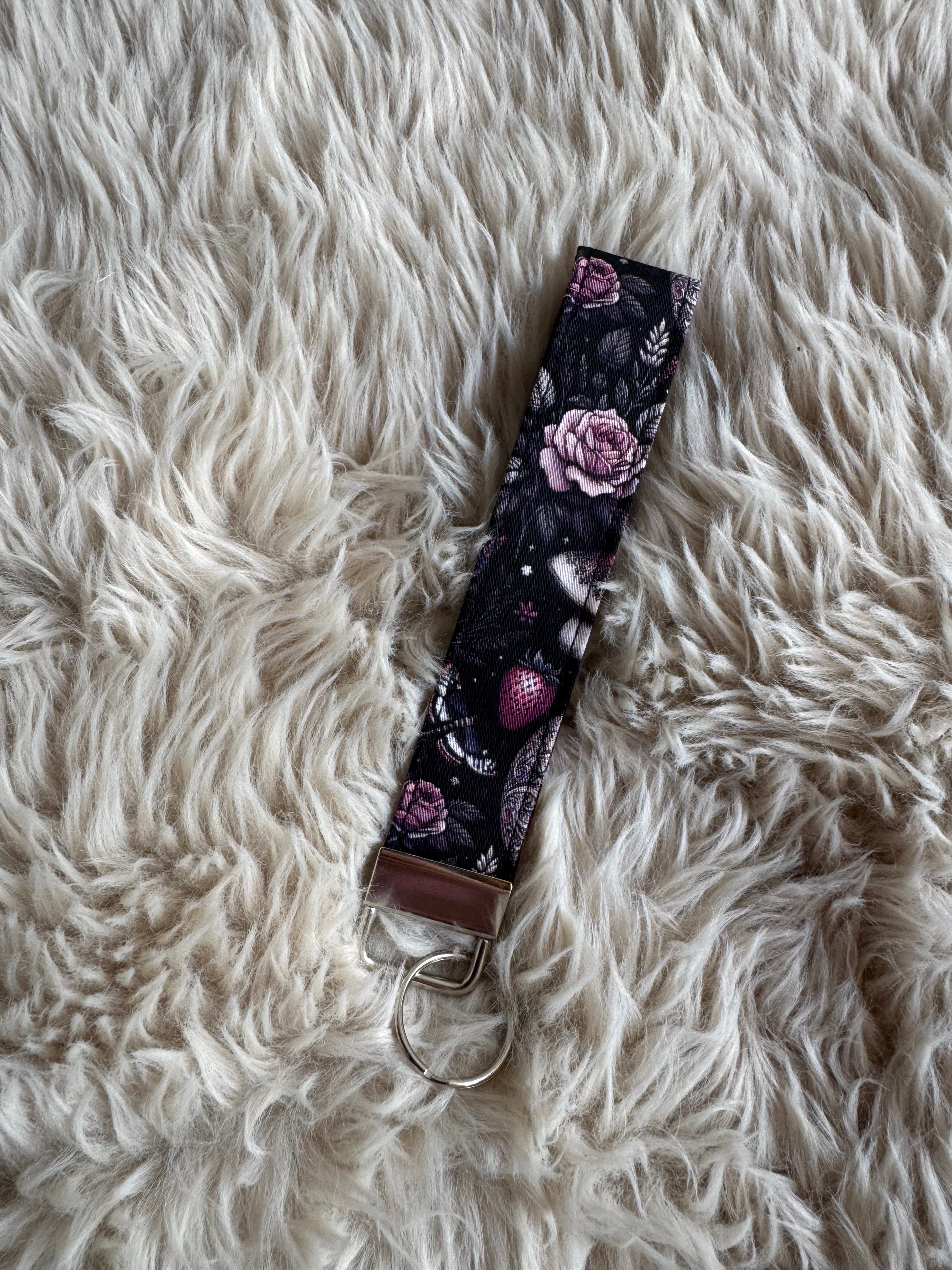 Black cat night garden Wristlet